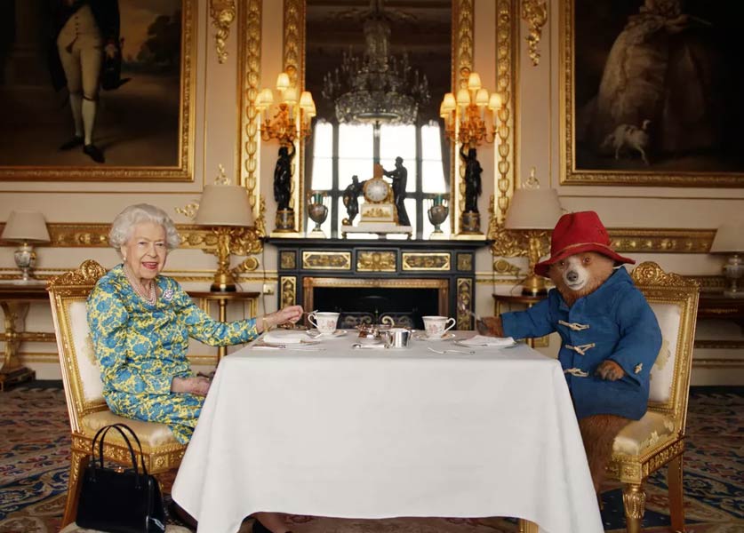 Queen Elizabeth Shares a Cup of Tea with Paddington Bear Queen Elizabeth Shares a Cup of Tea with Paddington Bear