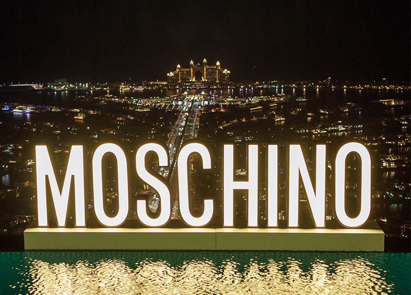 Moschino Celebrates Resort 2023 above The Palm