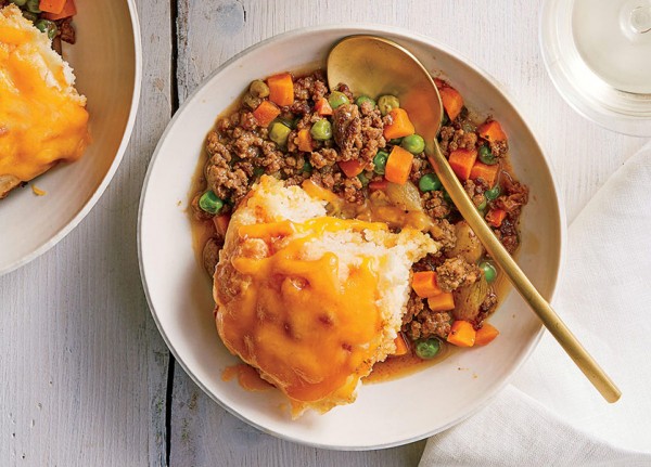 Stew of meat and bread with cheddar cheese