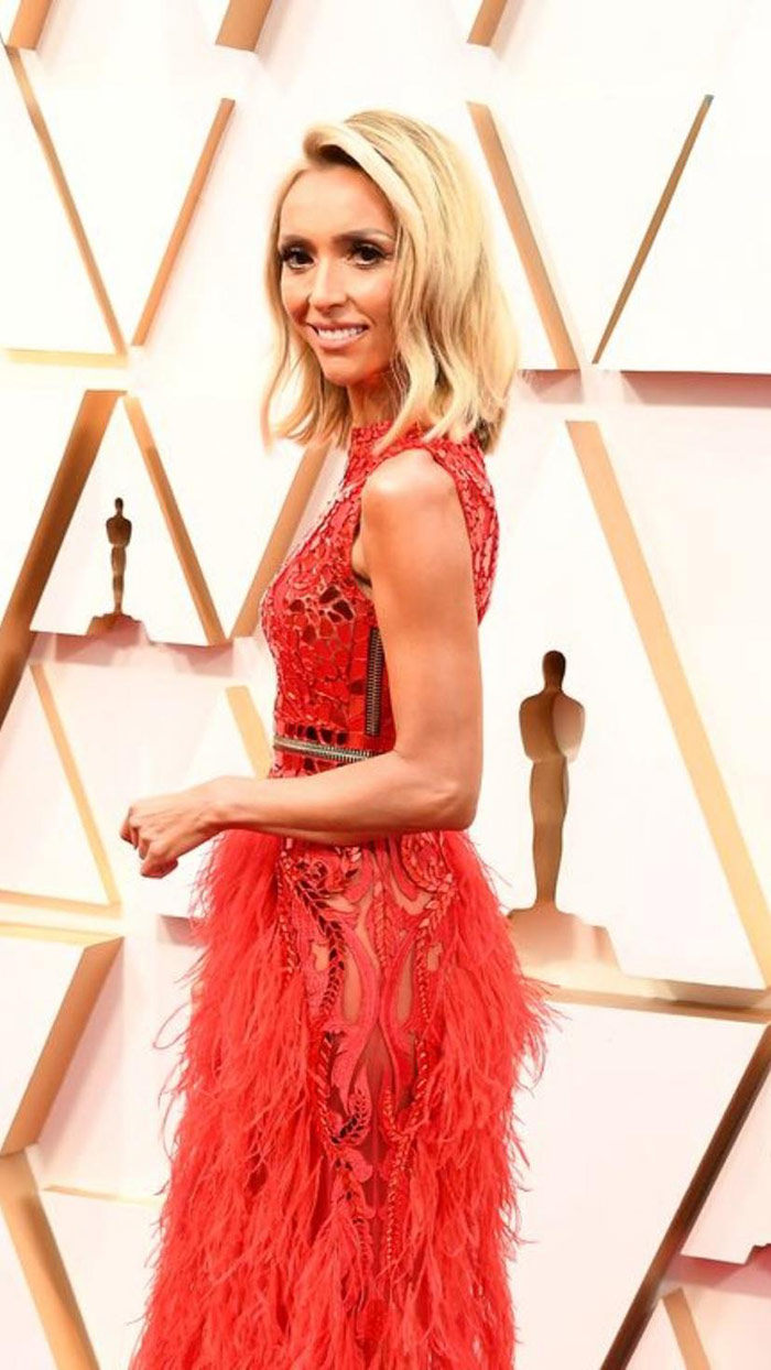 Giuliana-Rancic-shines-in-an-Atelier-Zuhra-red-gown-embellished-with-shiny-stones-and-feathers