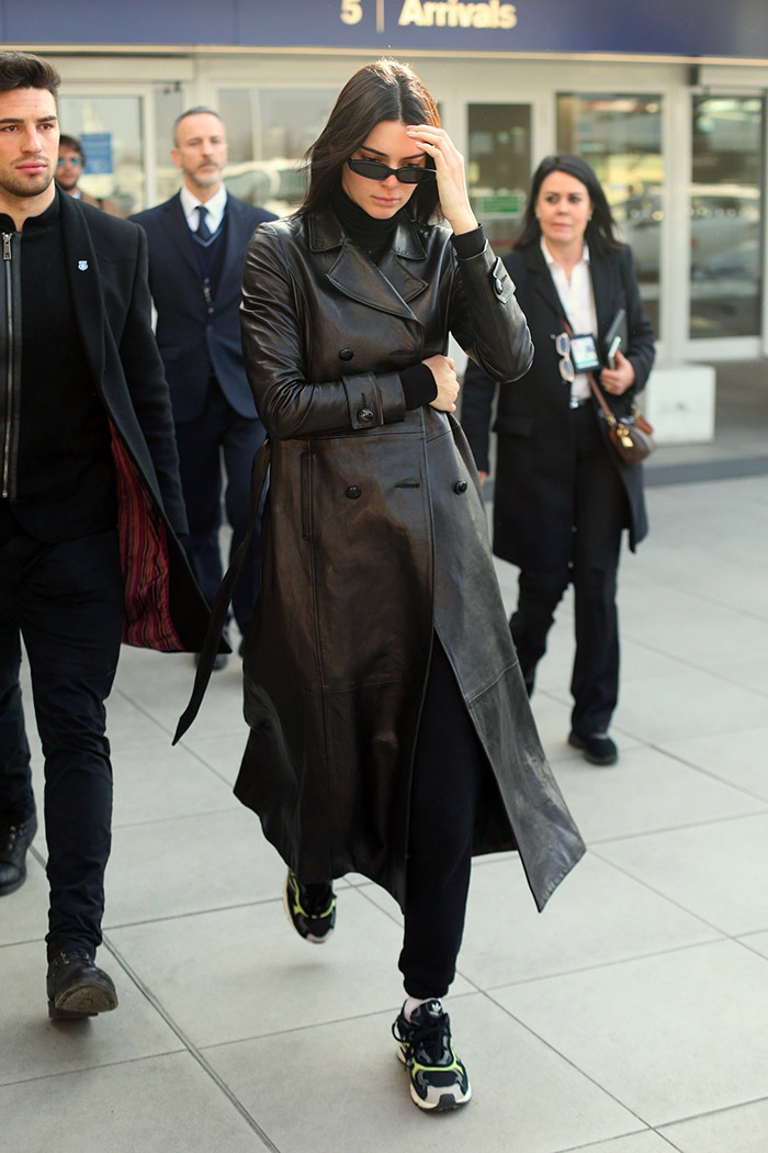 Kendall-Jenner-pairing-her-leather-coat-with-a-pair-of-sneakers