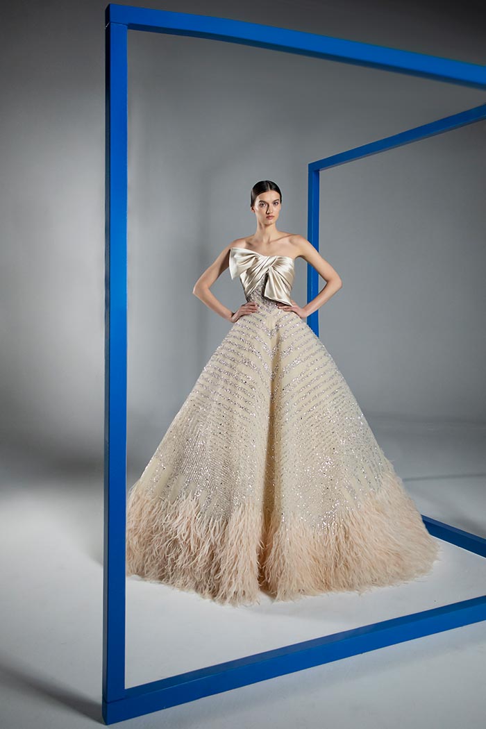 SS21-9-Pearled-ivory-ball-gown-embroidered-with-psychedelic-patterns-of-crystals-and-ostrich-feathers,-featuring-a-satin-duchess-voluminous-bow-