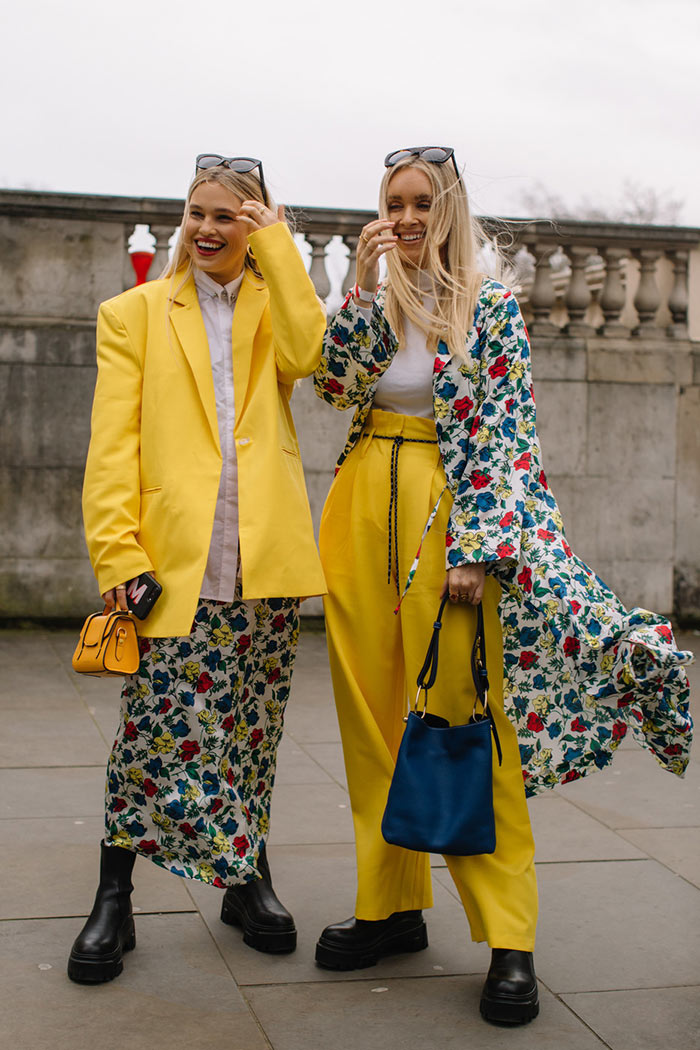 Two-guests-wearing-yellow-at-London-Fashion-Week-Fall-2020