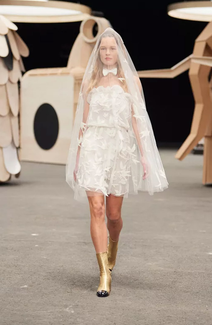 Anna Ewers wore a mini bridal gown embroidered with swallows to