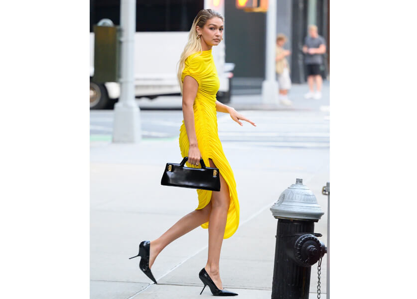 Gigi Hadid Radiates Elegance in Striking Yellow Ferragamo Dress at the Victoria's Secret Fashion Show Tour
