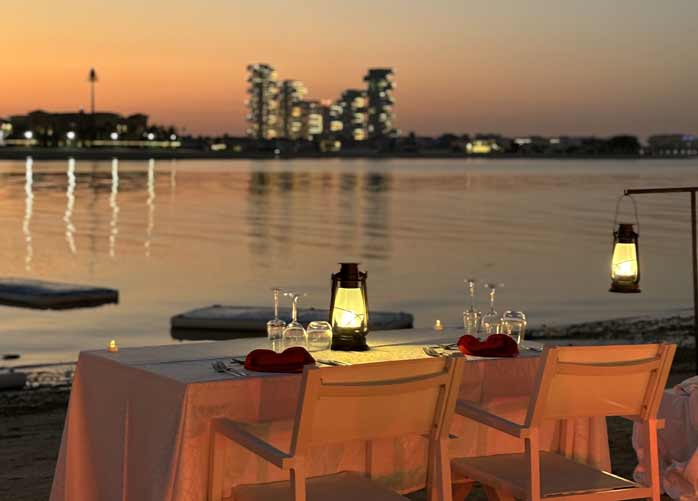 Experience a Romantic Sunset Dinner by the Beach in Dubai
