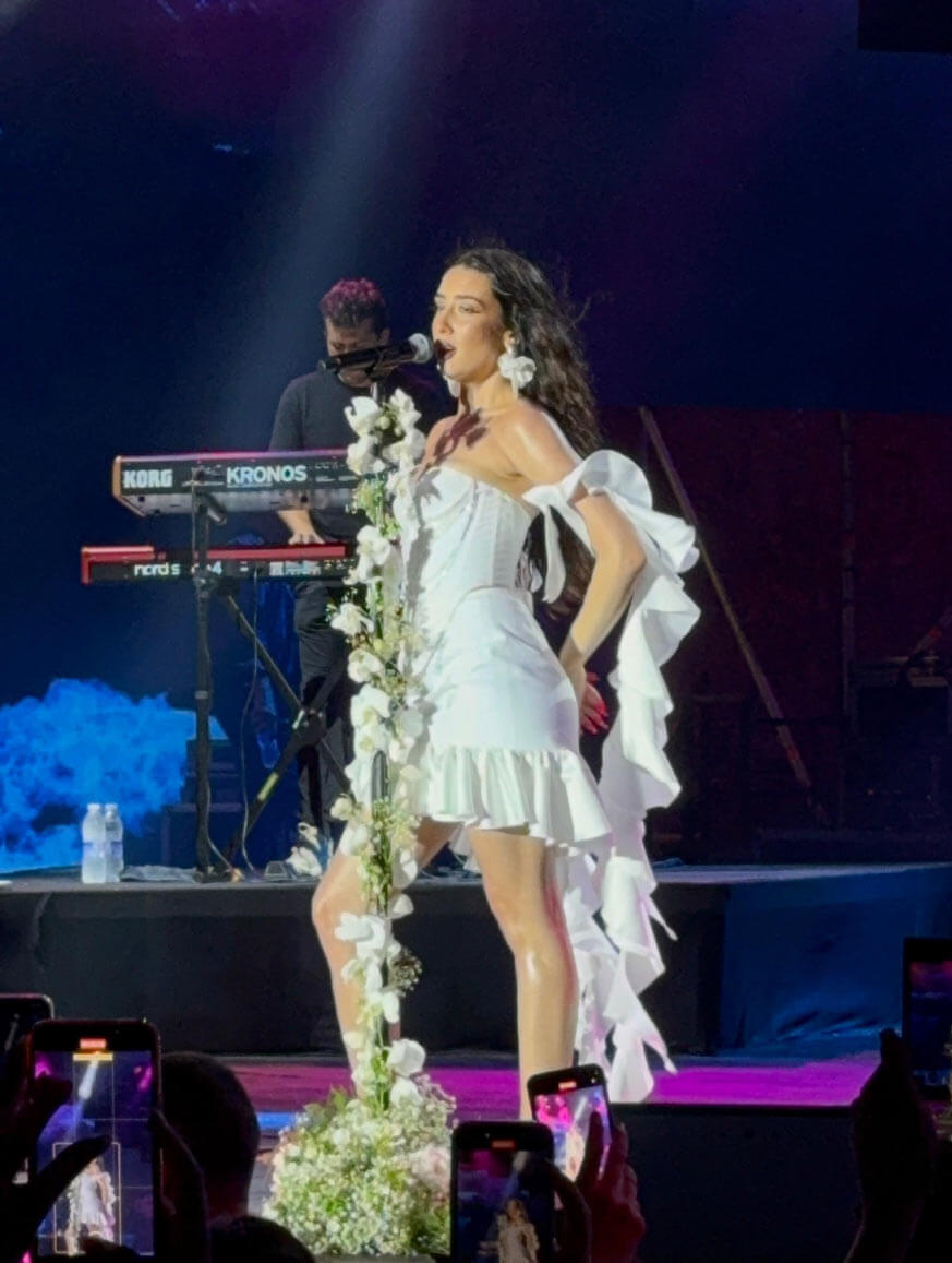 Naika Performs in Lebanon in an Angelic Basil Soda Look